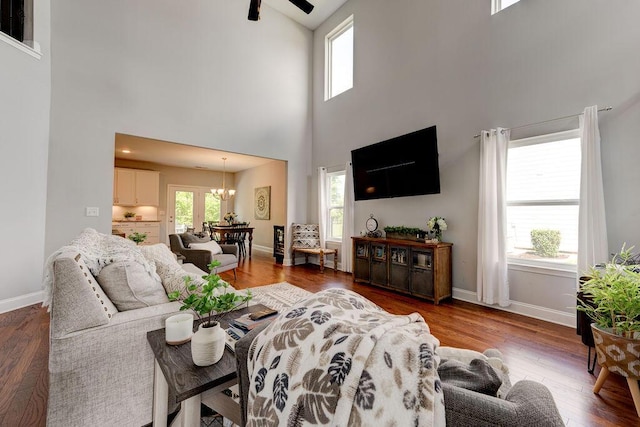 1494 Buttonwood, Chattanooga, TN 37421 - living room with a towering ceiling, a chandelier, wood finished floors, baseboards, and a ceiling fan