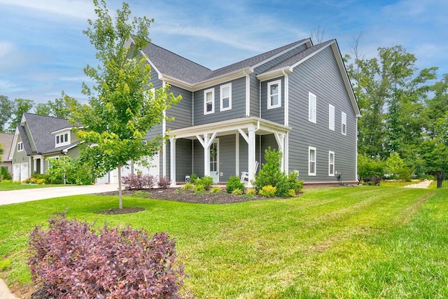 1494 Buttonwood, Chattanooga, TN 37421 - view of front of house featuring covered porch, a front lawn, driveway, and a garage