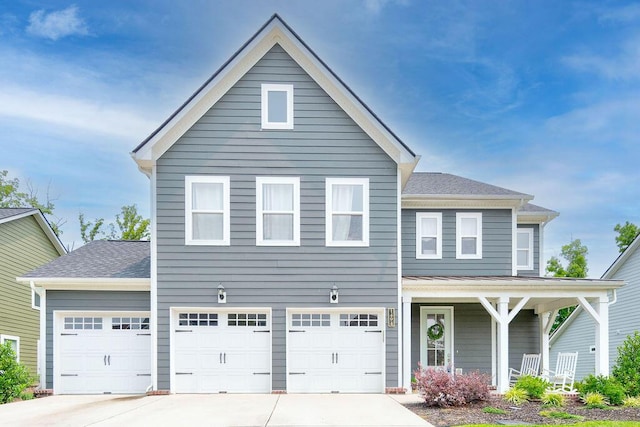 1494 Buttonwood, Chattanooga, TN 37421 - traditional home with concrete driveway, covered porch, a shingled roof, and an attached garage