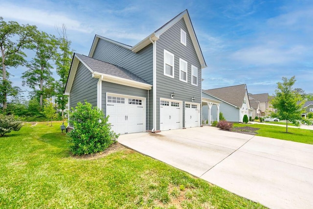 1494 Buttonwood, Chattanooga, TN 37421 - view of side of property featuring concrete driveway, a garage, and a yard