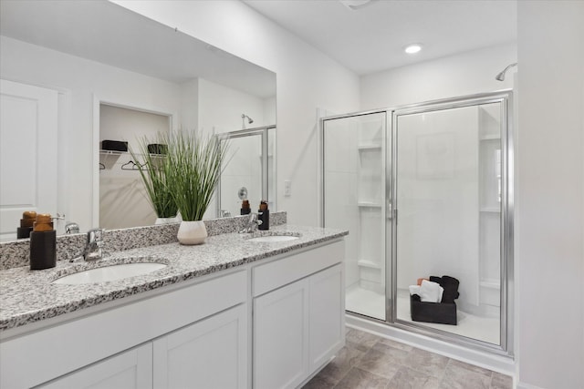 bathroom featuring vanity and walk in shower