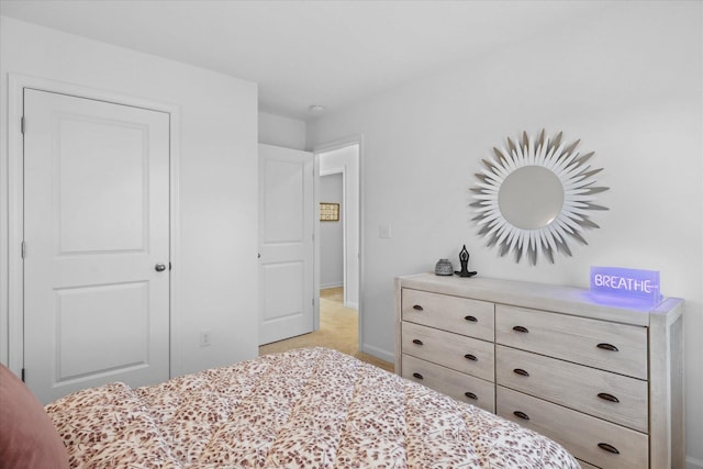 bedroom featuring light colored carpet