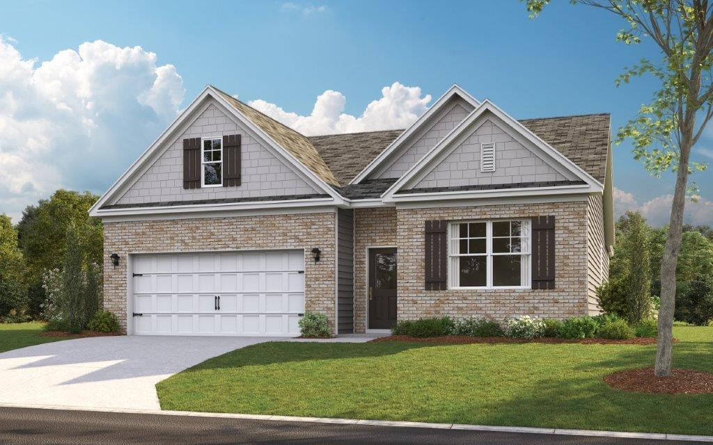 view of front of house featuring a front yard and a garage