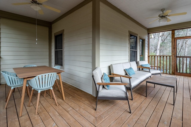 sunroom featuring ceiling fan