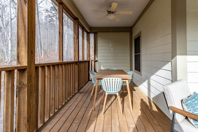 sunroom / solarium with ceiling fan