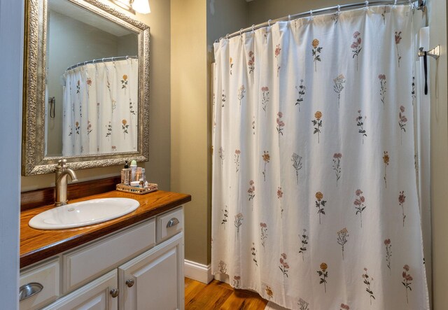 bathroom featuring vanity and wood-type flooring