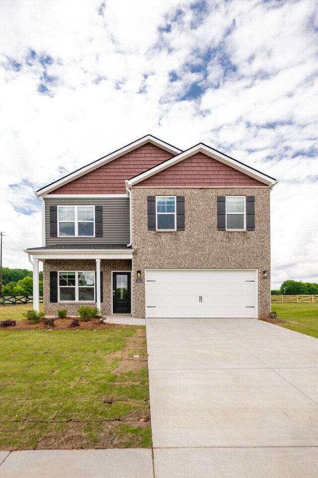 4203 Scenic Trl NE, Cleveland, TN 37323 - craftsman-style house featuring a garage, concrete driveway, and a front yard
