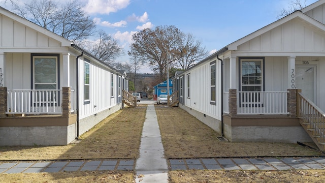 view of side of home featuring a porch