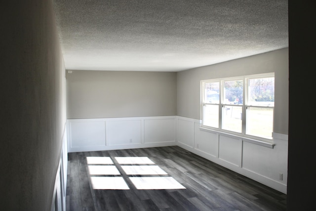 empty room featuring dark hardwood / wood-style floors