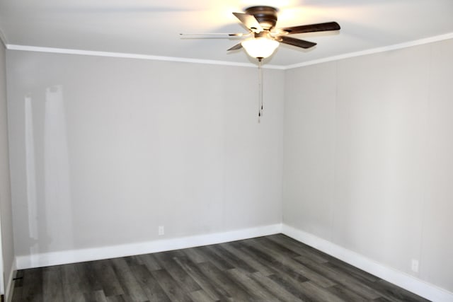 spare room featuring dark hardwood / wood-style floors, ceiling fan, and ornamental molding