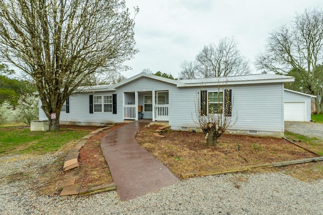 ranch-style house with a porch, a garage, and an outdoor structure