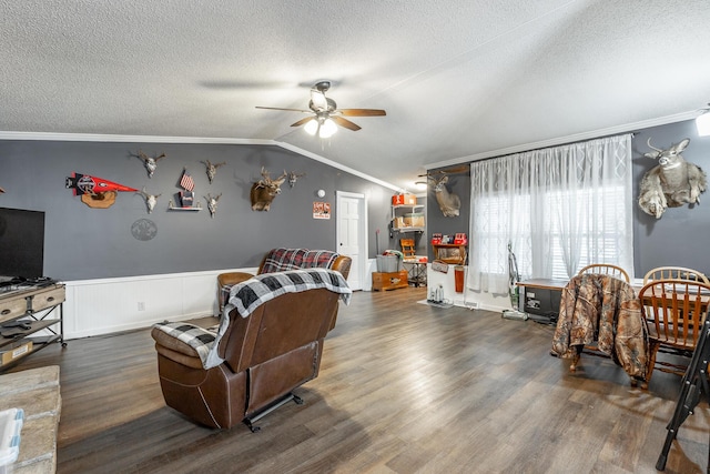 living room with dark hardwood / wood-style floors, vaulted ceiling, and ceiling fan