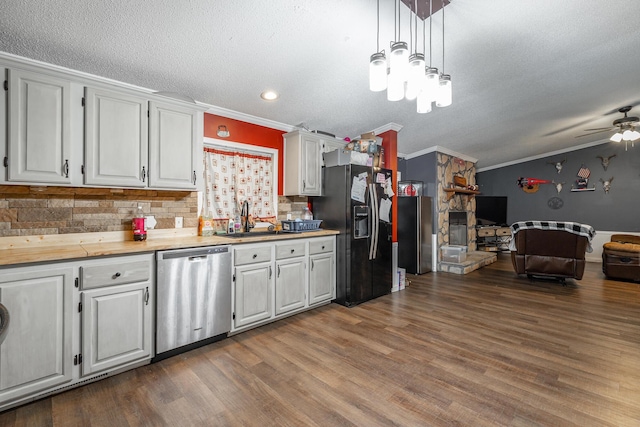 kitchen featuring dishwasher, dark hardwood / wood-style flooring, and white cabinetry