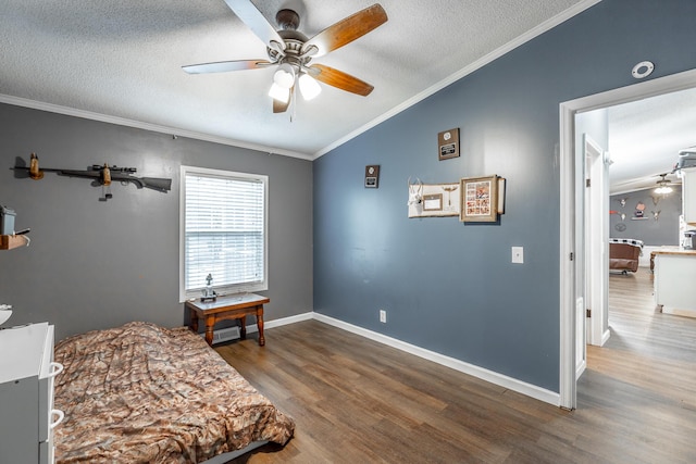 interior space with a textured ceiling, dark hardwood / wood-style flooring, lofted ceiling, and crown molding