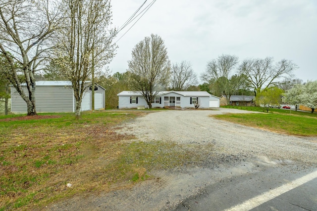 view of front facade with a garage and a front lawn