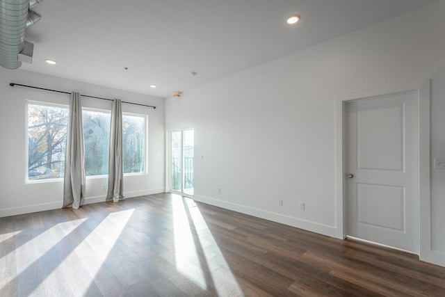 empty room featuring dark wood-type flooring