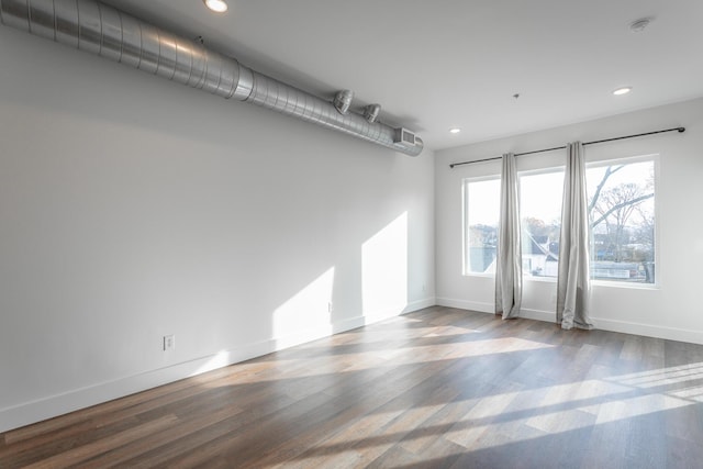 spare room featuring hardwood / wood-style floors