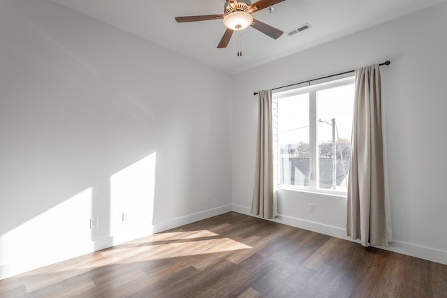 empty room with ceiling fan and hardwood / wood-style floors