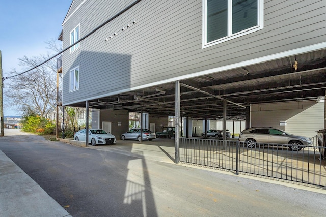 view of vehicle parking with a carport