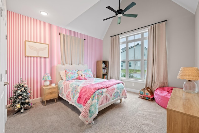 carpeted bedroom with ceiling fan and vaulted ceiling