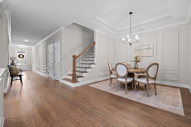 dining area featuring a chandelier, dark hardwood / wood-style flooring, and crown molding