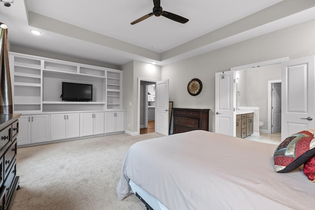 carpeted bedroom with connected bathroom and ceiling fan