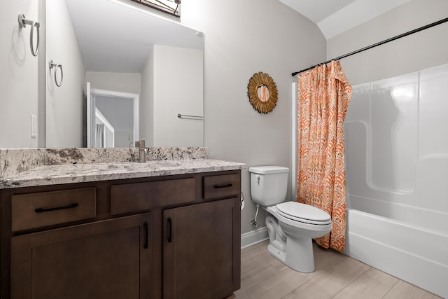 full bathroom with vanity, vaulted ceiling, hardwood / wood-style flooring, toilet, and shower / bathtub combination with curtain