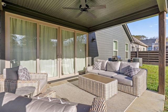 sunroom with ceiling fan and wood ceiling