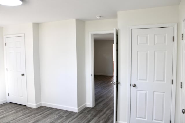 unfurnished bedroom with dark hardwood / wood-style floors