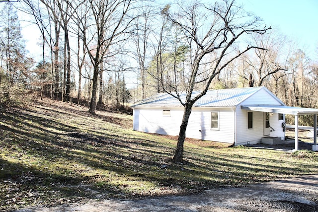 view of property exterior featuring a lawn