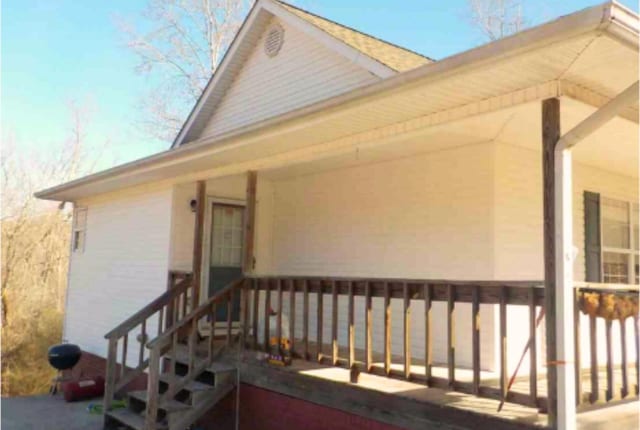 property entrance featuring covered porch