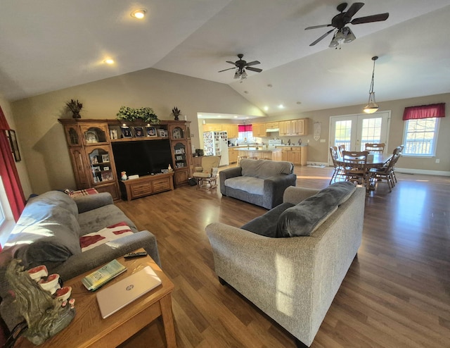 living room featuring french doors, ceiling fan, vaulted ceiling, and dark wood-type flooring