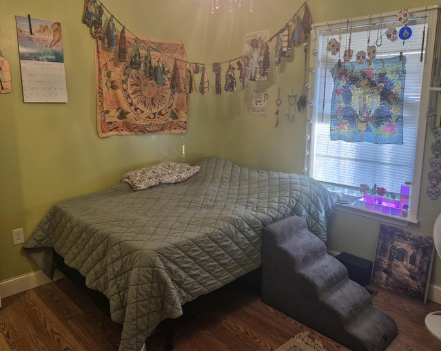 bedroom featuring dark wood-type flooring