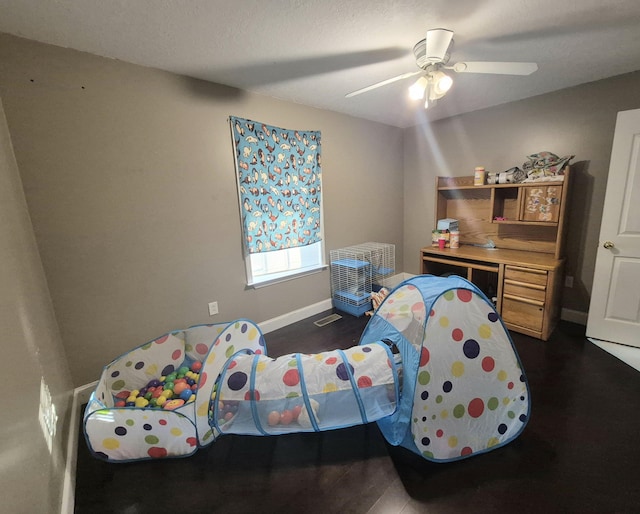 bedroom featuring ceiling fan and dark hardwood / wood-style floors