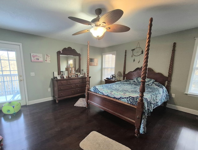 bedroom with access to outside, dark wood-type flooring, ceiling fan, and multiple windows