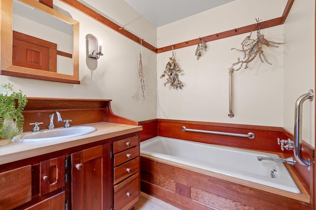 bathroom with vanity and a bathtub