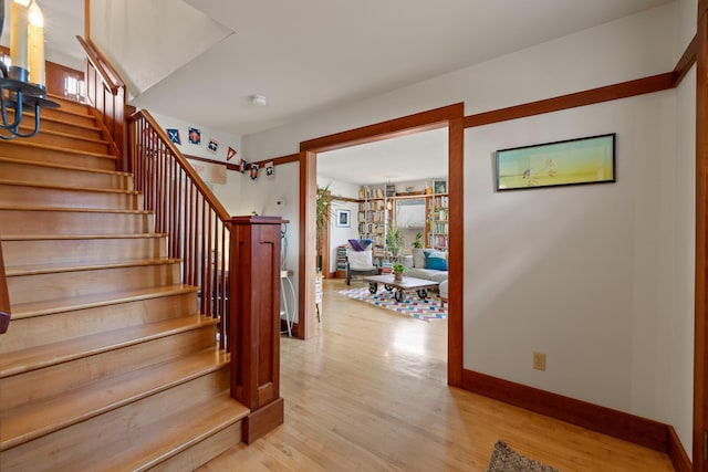 stairs featuring wood-type flooring