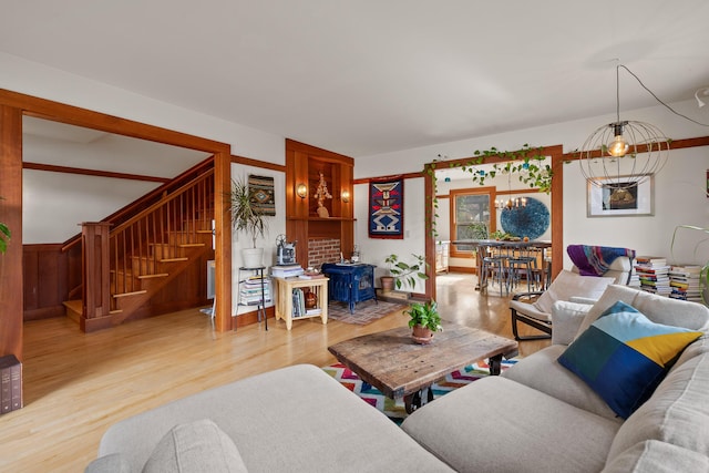 living room featuring a chandelier and hardwood / wood-style floors