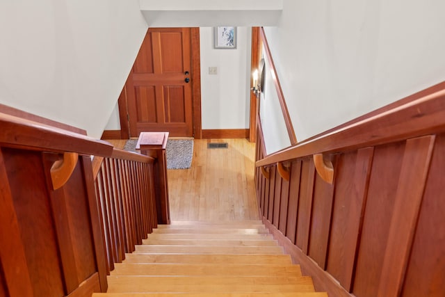 stairway with wood-type flooring