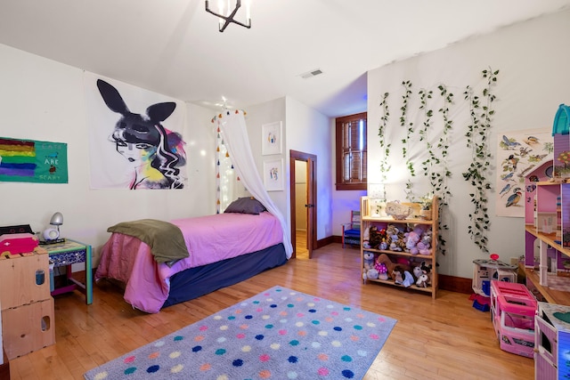 bedroom featuring wood-type flooring