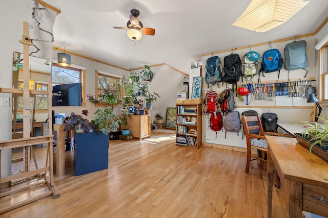 misc room with hardwood / wood-style flooring, ceiling fan, and crown molding