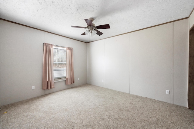 unfurnished room featuring ceiling fan, carpet floors, and a textured ceiling