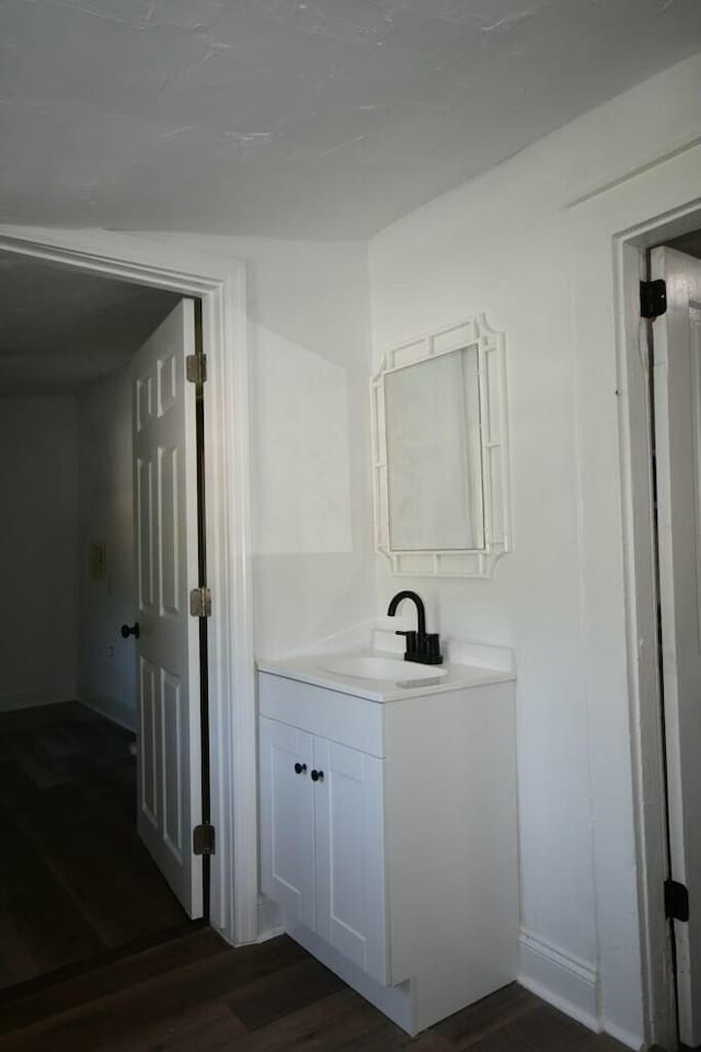 bathroom with vanity and hardwood / wood-style flooring