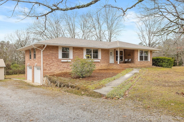 view of front of house with covered porch and a garage