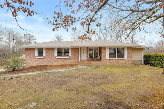 ranch-style home featuring a front yard