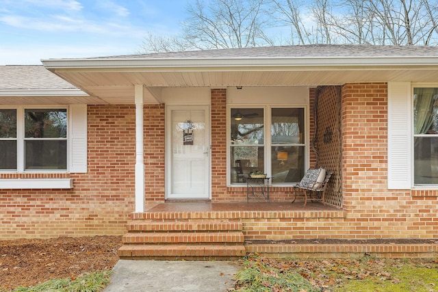 view of exterior entry with a porch