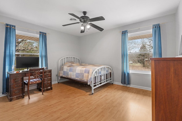 bedroom with hardwood / wood-style floors and ceiling fan