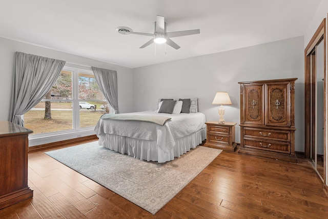 bedroom featuring wood-type flooring and ceiling fan