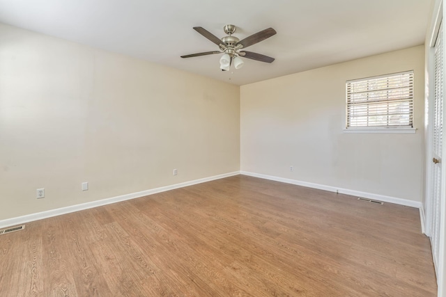 spare room featuring ceiling fan and light hardwood / wood-style flooring