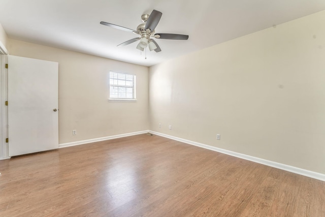 spare room featuring ceiling fan and light hardwood / wood-style floors